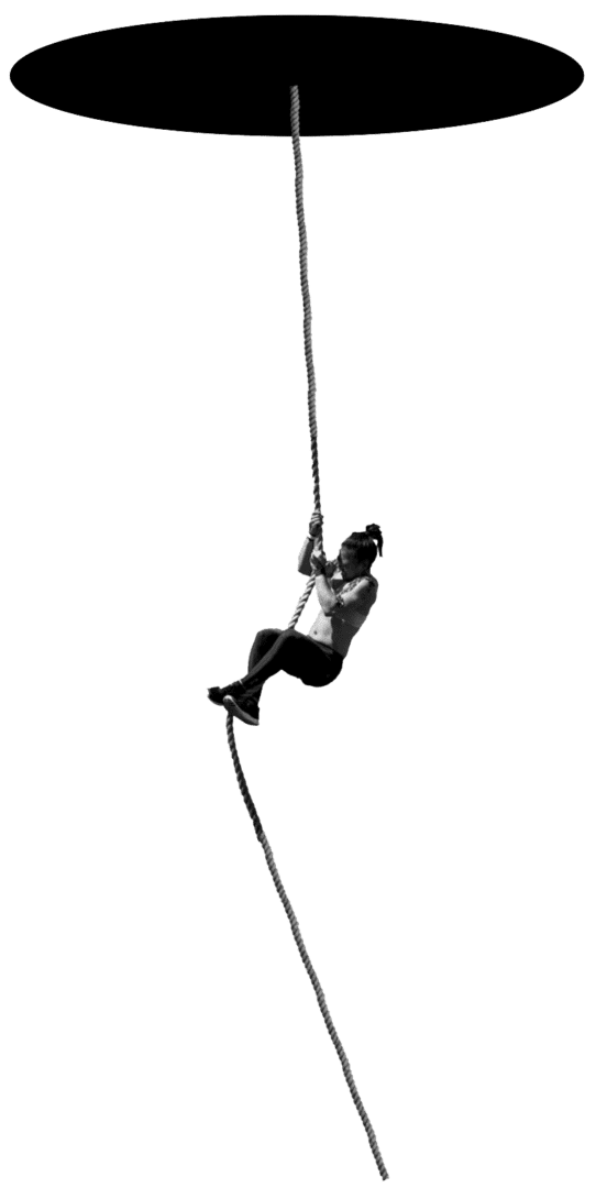 A man is climbing on the rope